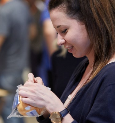 Attendee holding a Mozilla gadget.